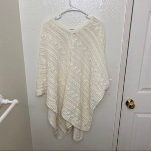 Knitted cream color poncho.